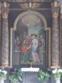 Kalapos madonna a katolikus templom oltárképén Homoródkarácsonyfalva